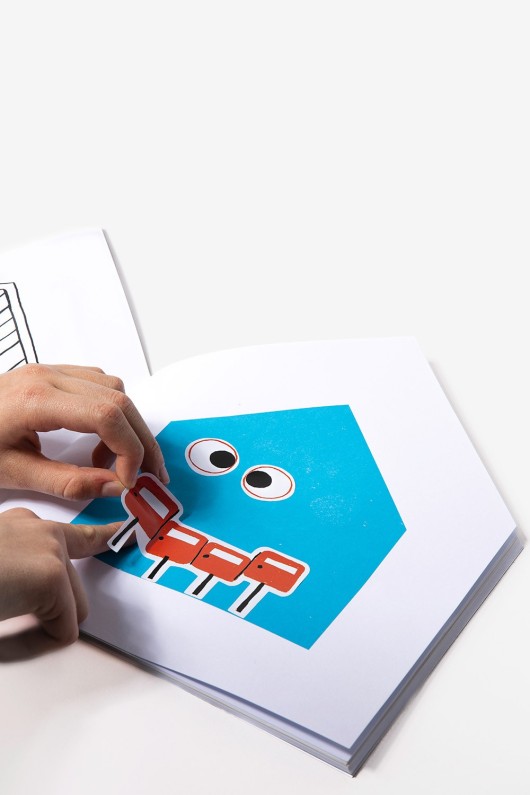 hands-stick-stickers-on-book