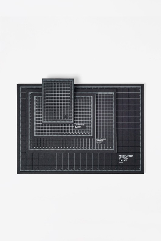 four-planners-laying-back-black-tiles