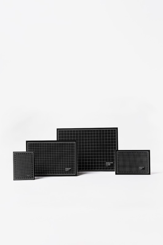 four-planners-standing-back-black-tiles