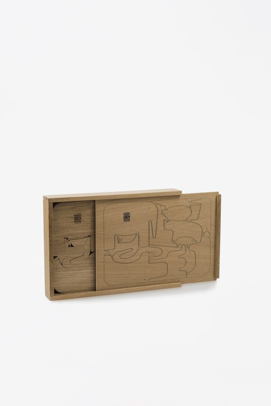 wooden puzzle with animals in opened box