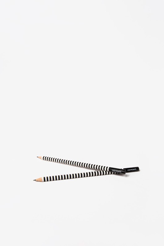 two-black-and-white-striped-pencils-piled
