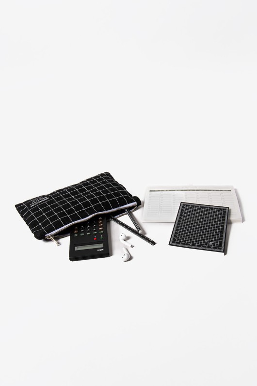 black squared pocket with calculator, earphones, pencils and calendars