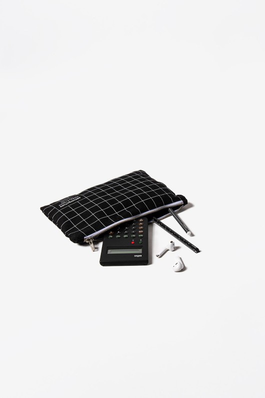black squared pocket with calculator, earphones and pencils