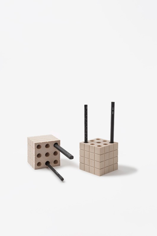 wooden pen boxes with black bencils inside