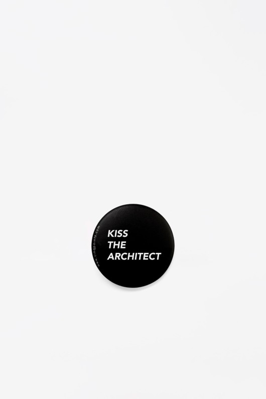 round black badge kiss the architect - front view