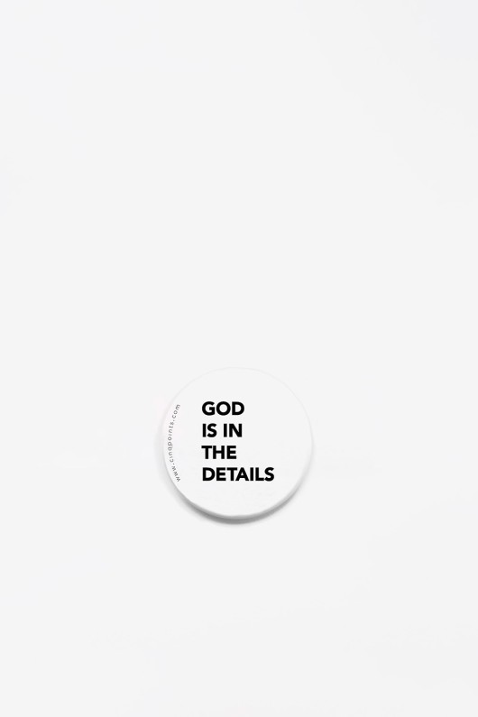 round-white-badge-god-is-in-the-details-front-view