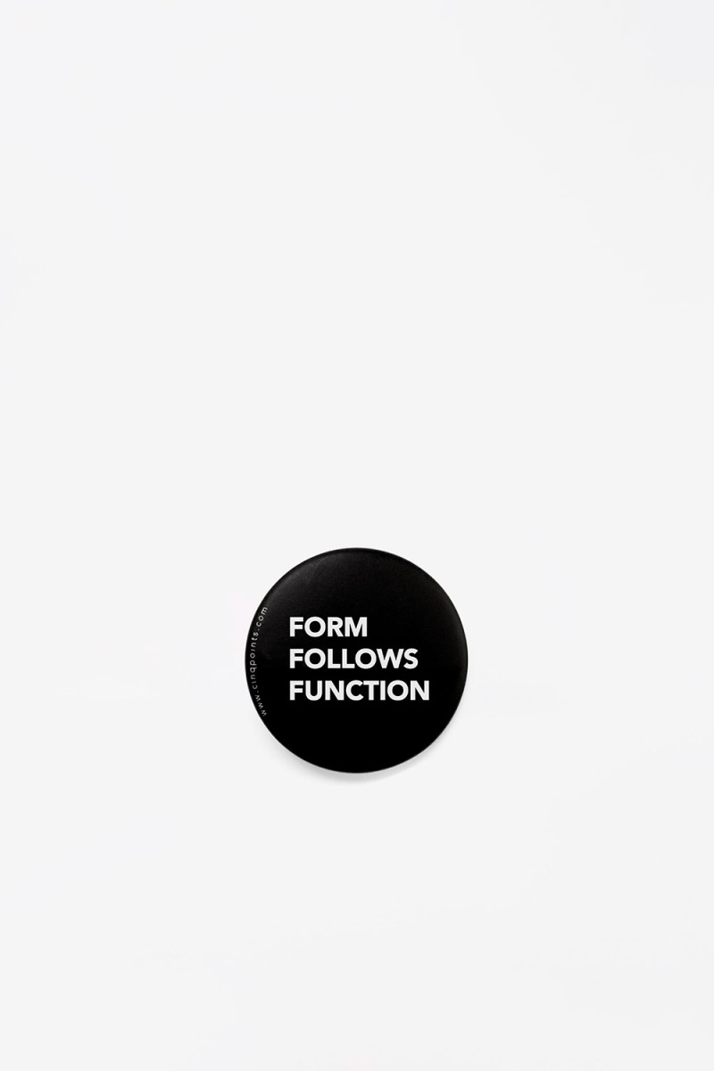 black-round-badge-form-follows-function-front-view