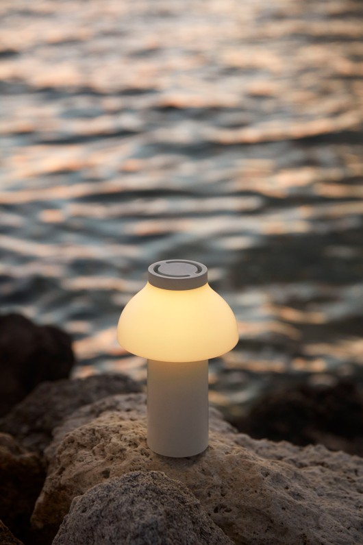 cream white pc portable lamp next to water - light on