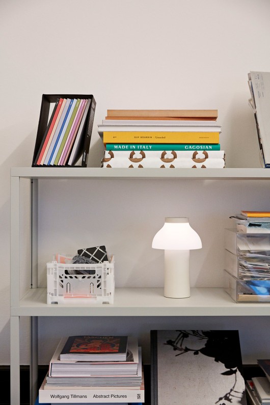 cream white pc portable lamp on shelf - light on