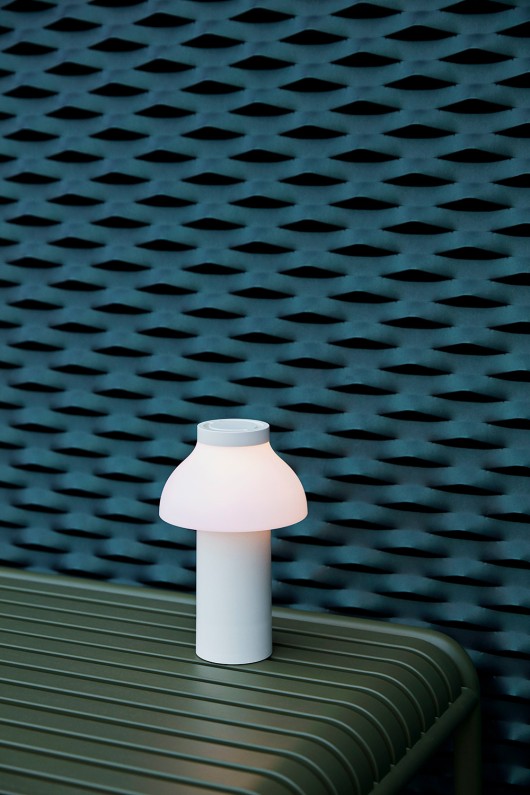 cream-white-pc-portable-lamp-in-front-of-blue-panel-light-on