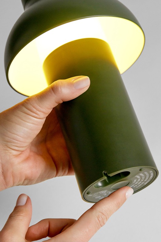hand lights on portable lamp olive