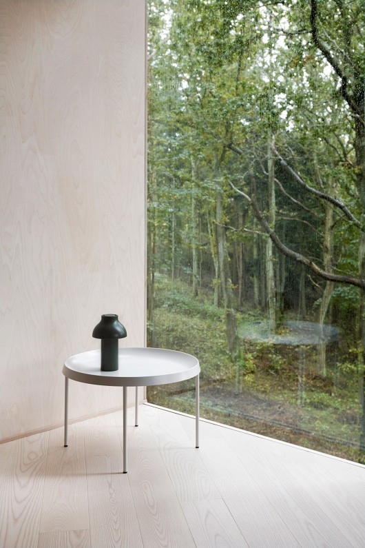 olive portable lamp on table with forest